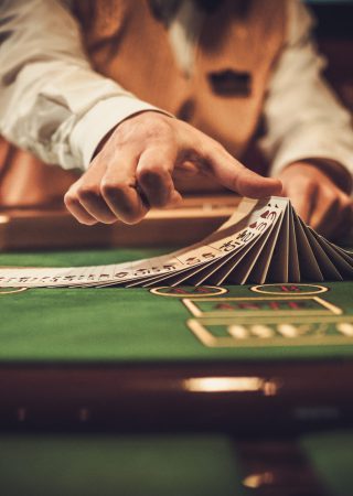 Croupier behind gambling table in a casino.